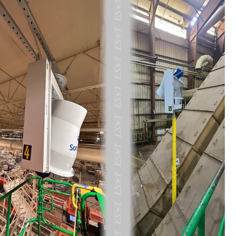 A large industrial fan mounted on the ceiling of a warehouse, providing energy-efficient ventilation and air circulation.